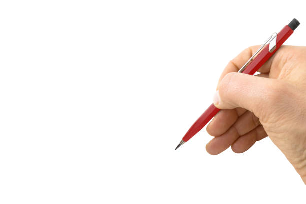 istock Male hand writing with a red pencil on white background - concept with copy space 1365649950