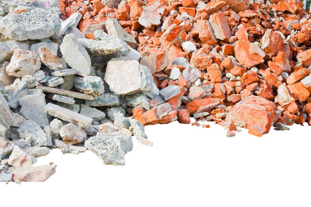 istock Concrete and brick rubble debris on construction site after a demolition of a brick building - image isolated on white for easy selection and copy space 1365650699