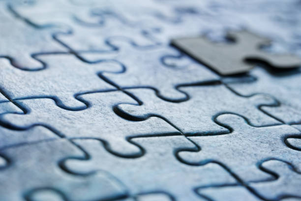 istock Assembled puzzles in visual perspective. Macro. Selective focusing. Shallow depth of field. Close-up 1365650927