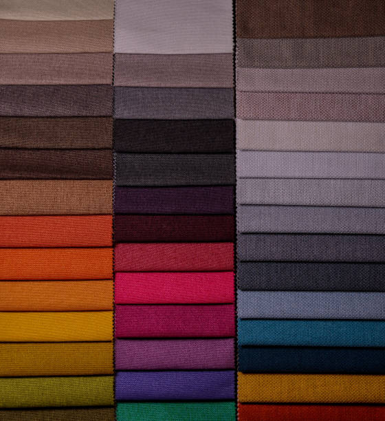 istock Samples of furniture fabrics.Multicolor fabric texture background. 1365651155