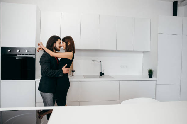 istock A loving couple hugs tenderly in a cozy home environment 1365651775