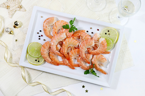 Fresh shrimps on a white background. Christmas decoration. Directly above. Christmas and holiday season.