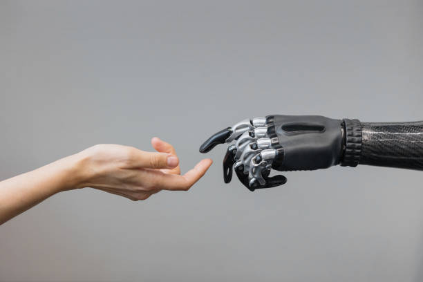 istock the human hand and the siber hand bionic prosthesis make a handshake and greeting. modern technologies of prosthetics 1365653124