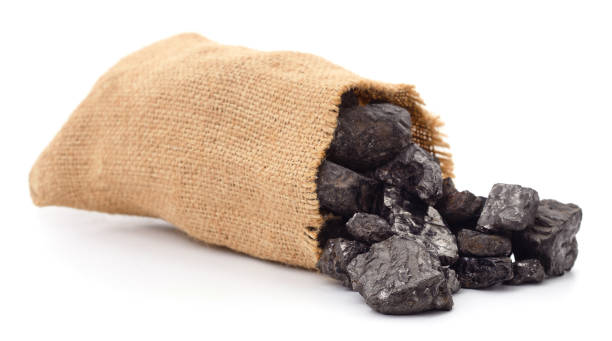 Coal in a bag. Coal in a bag isolated on a white background. hard bituminous coal stock pictures, royalty-free photos & images