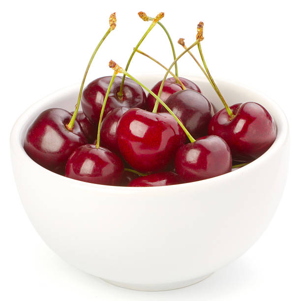 istock Red ripe cherries in a bowl on white background 136565559
