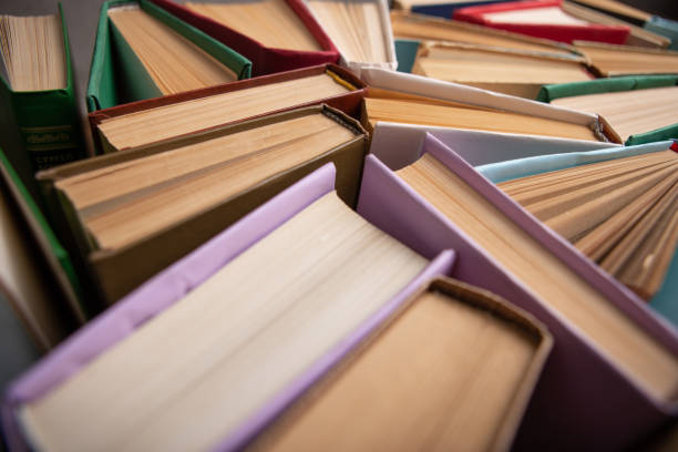 istock Books background for wisdom, science and education. Reading and writing concept 1365657441