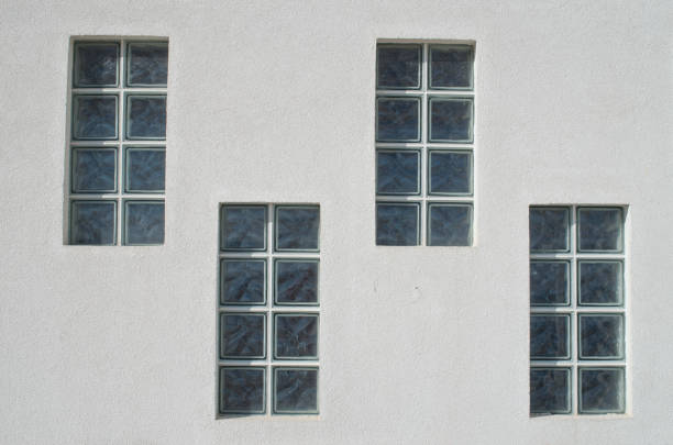 istock Four glass block windows looking outside on wall 1365659689