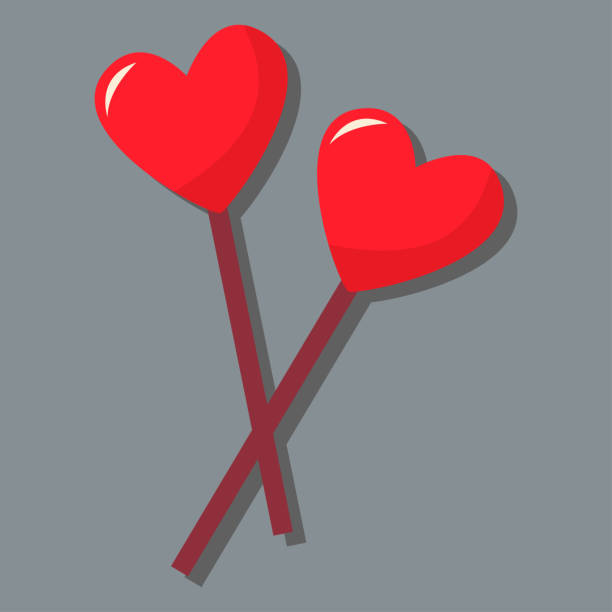 istock Two hearts on a stick. Day of love. 1365660284