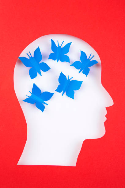 istock Human head in paper cut style and butterflies 1365665222