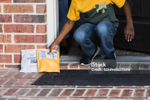 Boy receives delivered packages