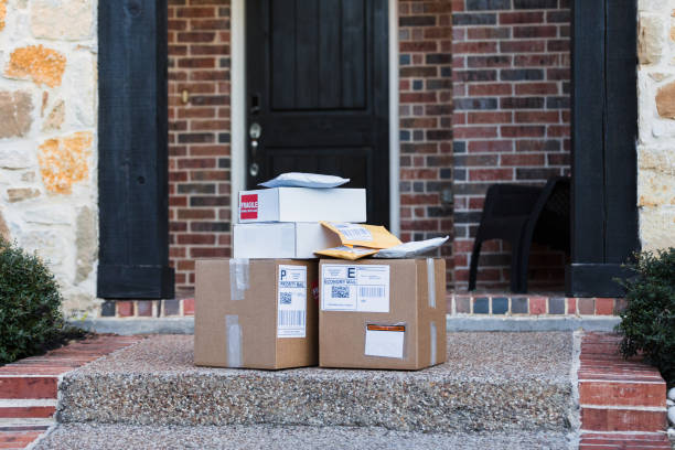 istock Packages for shipping on front walkway of home 1365666679