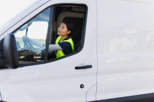 Careful female driver parks delivery van