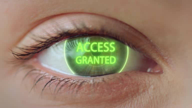 Close up eye access system analysing biometrics granting connection concept