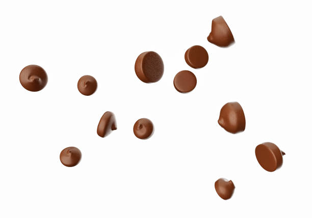 istock Chocolate Chips Flying isolated on white background 3d illustration 1365669339