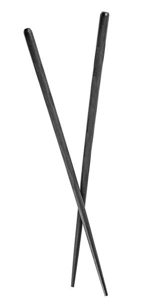 istock Black wooden chopsticks isolated on a white background, top view. 1365671377