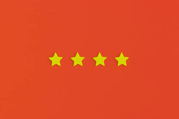 istock Four 4 stars, best excellent services rating on red background. 1365672461