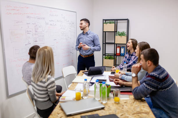 istock young creatives having a meeting. man in front of a whiteboard 1365672802