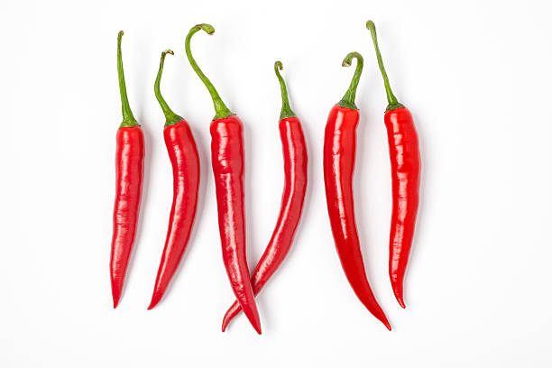 istock Six red hot chili peppers in a row 136567860