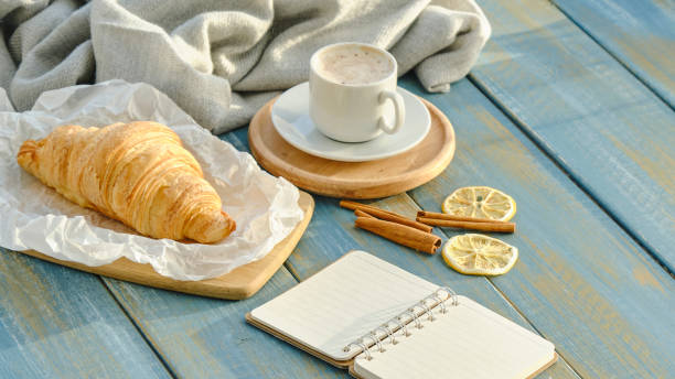 istock French Breakfast with Croissants and Coffee on wooden background 1365679010