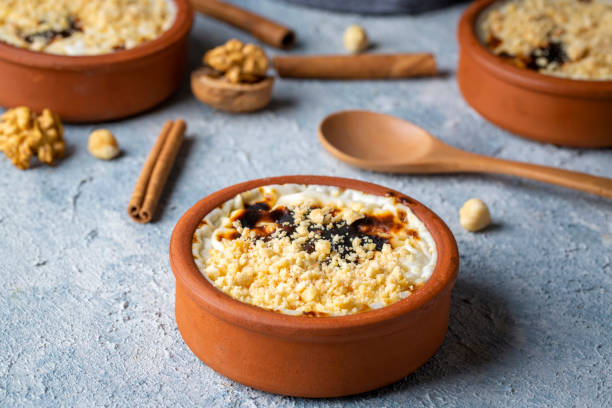 istock Baked rice pudding turkish milky dessert sutlac in earthenware casserole with hazelnuts 1365680728