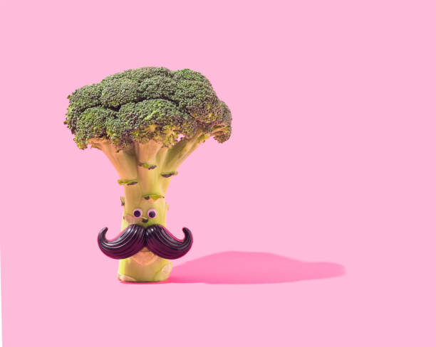 istock Broccoli tree with moustache and eyes on a pastel violet background. 1365683436