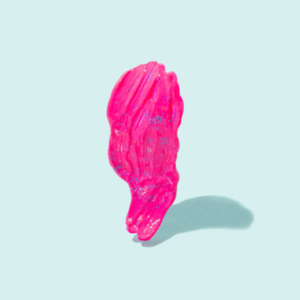 istock Acrylic magenta paint stroke with glitter on a pastel blue background. 1365683602