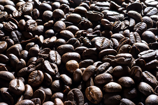 a background formed with some roasted coffee beans
