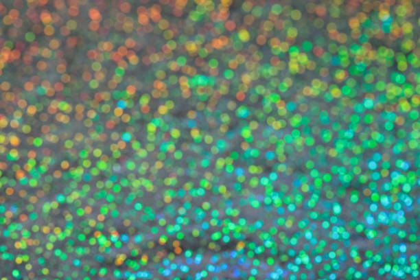 istock Abstract blurred background of holographic rainbow fabric 1365684871