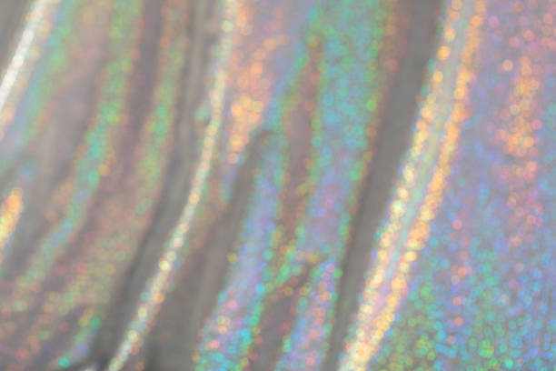 istock Abstract blurred background of holographic rainbow fabric 1365684915