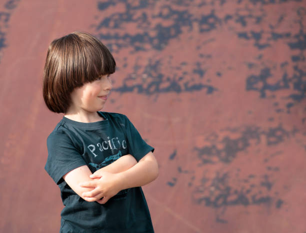 istock Child smiles and crossed hands on chest 1365685913