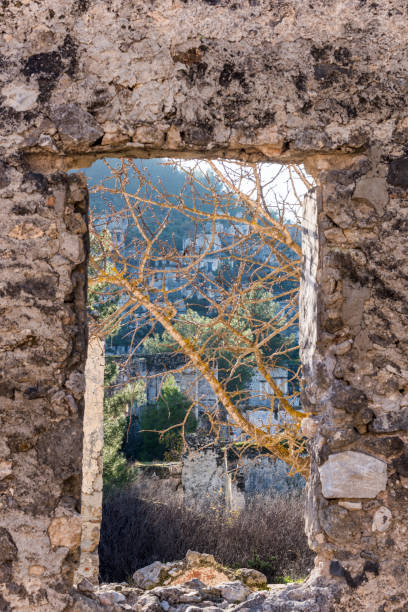 The building in this photo is Taksiyarhis Church or Upper Church (19 th Century) in Kayakoy village. Kayakoy (Levissi Village), which was abandoned by the Greeks during the population exchange long ago. Kayakoy is located within the borders of Fethiye, a district of Mugla, Turkey.