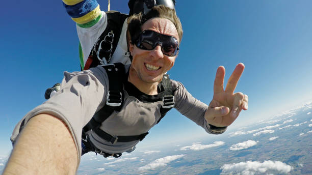 Sky diving selfie tandem jump stock photo