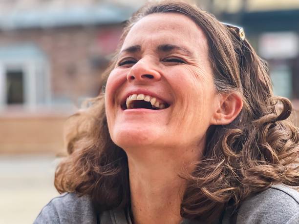 istock Mature woman laughing close up 1365689562
