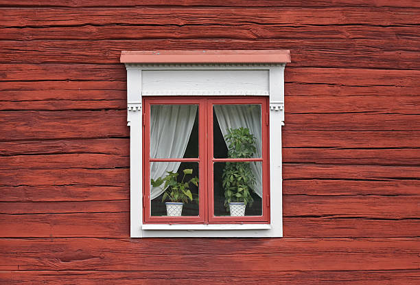 istock Cute Window on Red Wooden Wall 136569092