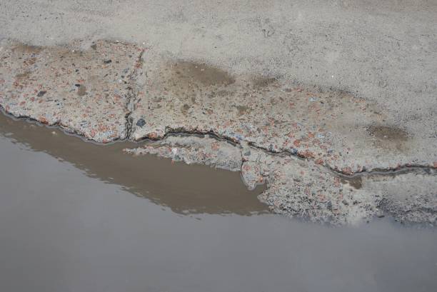istock part of a puddle with brown dirty water 1365692823