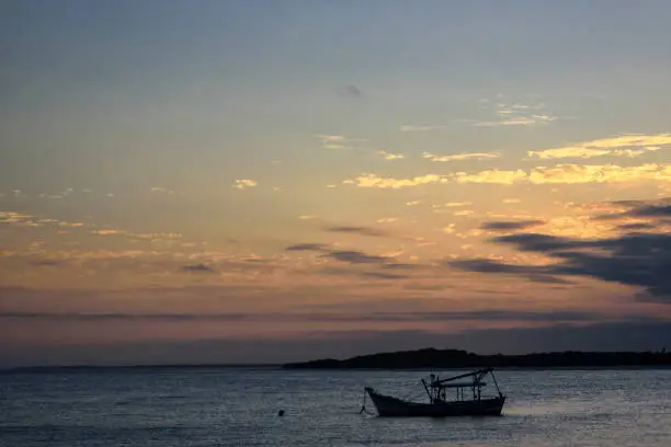 Fishing boat anchored in Paranaguá Bay in southern Brazil at dusk