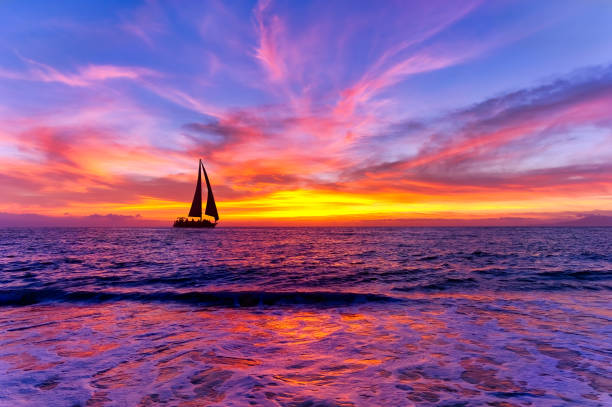 istock Sunset Ocean landscape Sailboat Silhouette 1365694182