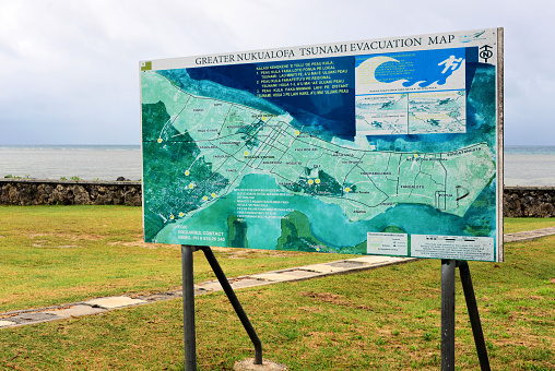 Nuku'alofa, Tongatapu island, Tonga: civil defense evacuation sign for the event of a Tsunami, not a rare event in this region affected by earthquakes and volcanos, resulting from the collision of the Australian, Pacific and Tonga tectonic plates - danger from the sea.