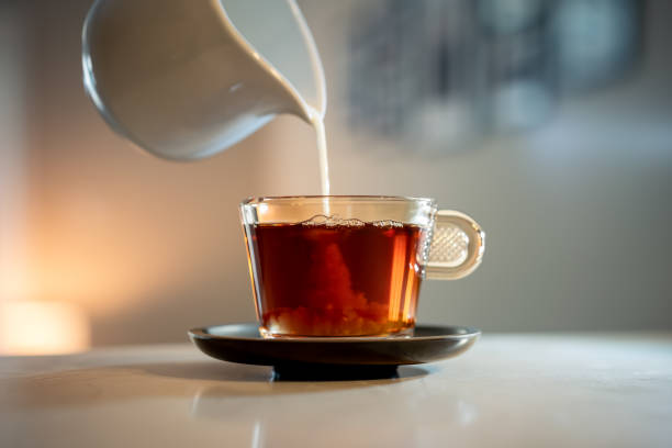 istock Hot british breakfast tea with milk in glass cup 1365695517
