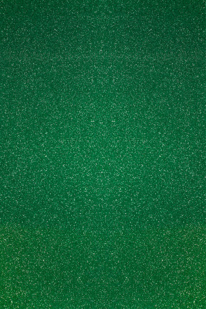 istock green color background with shiny particles 1365698517