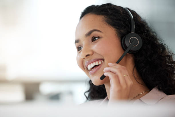 istock Shot of a young call centre agent working in an office 1365702564
