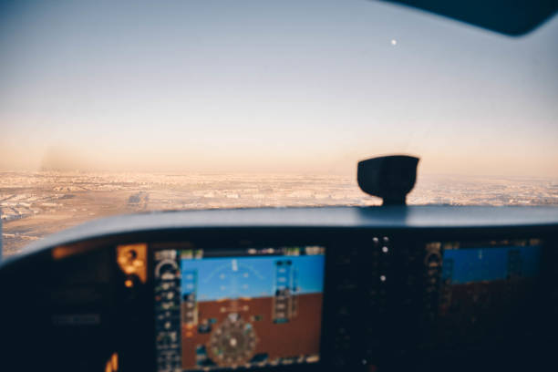 istock Cockpit of a small plane flying around at sunset 1365703748