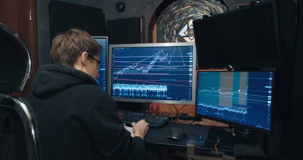 istock Man trader, freelancer on stock exchange trades options at home computer 1365709614
