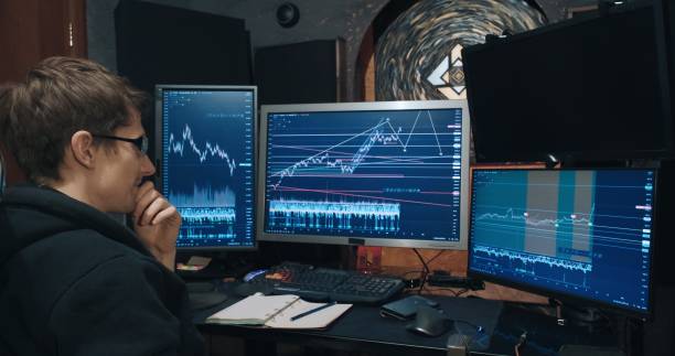 istock Man trader, freelancer on stock exchange trades options at home computer 1365709624