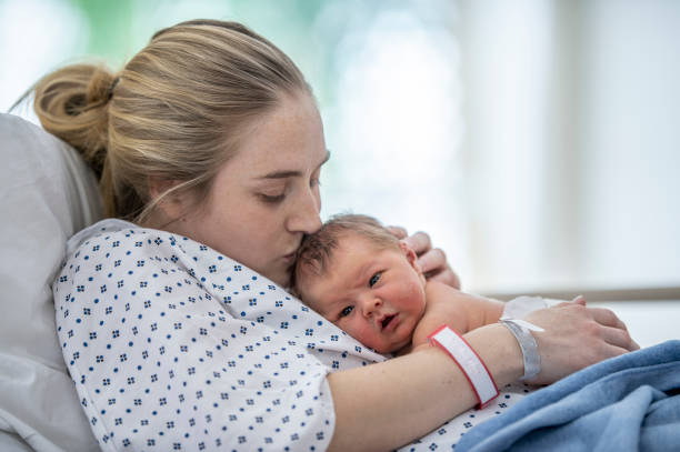 istock Kissing her new born baby 1365709657
