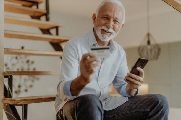 istock Senior man shopping online 1365710906