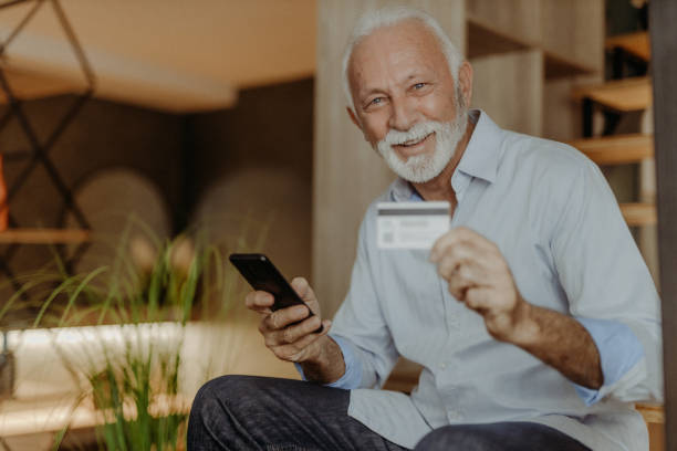 istock Senior man shopping online 1365711047