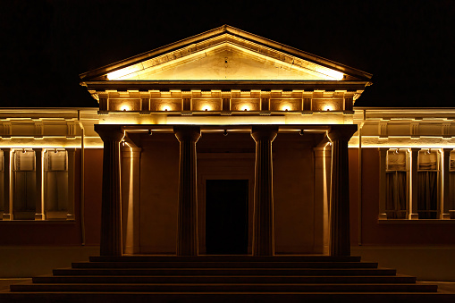 Classical architecture building with columns illuminated at night