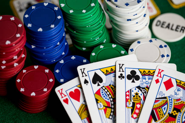 istock Poker concept with cards, gambling chips and money on green table 1365713771