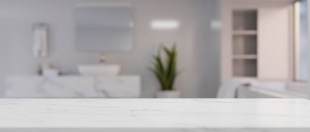 istock Copy space on marble white bathroom countertop over blurred modern white bathroom 1365735729